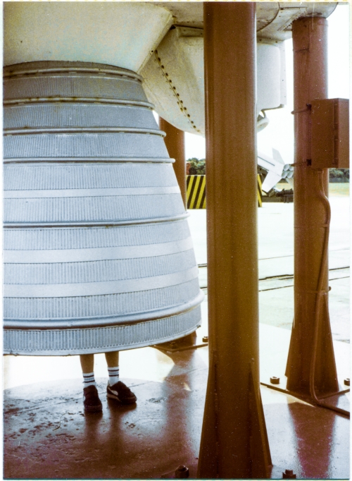 A very young Kai MacLaren stands inside the nozzle of the Rocketdyne LR79 MB-3 kerolox engine which propelled the Thor-Able rocket that is towering unseen directly above him, at the Air Force Space and Missile Museum at Cape Canaveral Air Force Station, Florida. Above and to the right of the nozzle, the enclosure which housed one of the two Rocketdyne LR101-NA vernier engines can be seen, along with just a very small bit of the nozzle of that vernier engine, protruding out to the right of the red support stanchion which holds up the Thor-Able. Below that, further in the distance, the cluster of four M5E1 solid-fuel motors along with lower control fins, on a Nike-Hercules surface-to-air defensive missile, can also be seen. Photograph by James MacLaren. A very young Kai MacLaren stands inside the nozzle of the Rocketdyne LR79 MB-3 kerolox engine which propelled the Thor-Able rocket that is towering unseen directly above him, at the Air Force Space and Missile Museum at Cape Canaveral Air Force Station, Florida. Above and to the right of the nozzle, the enclosure which housed one of the two Rocketdyne LR101-NA vernier engines can be seen, along with just a very small bit of the nozzle of that vernier engine, protruding out to the right of the red support stanchion which holds up the Thor-Able. Below that, further in the distance, the cluster of four M5E1 solid-fuel motors along with lower control fins, on a Nike-Hercules surface-to-air defensive missile, can also be seen. Photograph by James MacLaren.